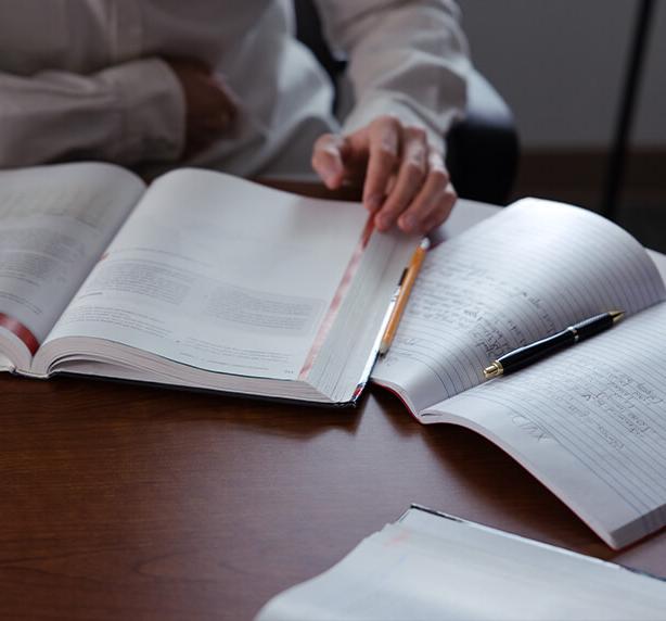 An open notebook with statistics work in it.